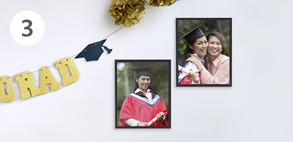 DIY graduation decoration featuring banner and garlands
