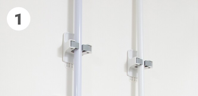 Wall mounted broom holder
