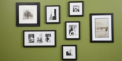 hanging pictures on a wall with picture hanging strips

