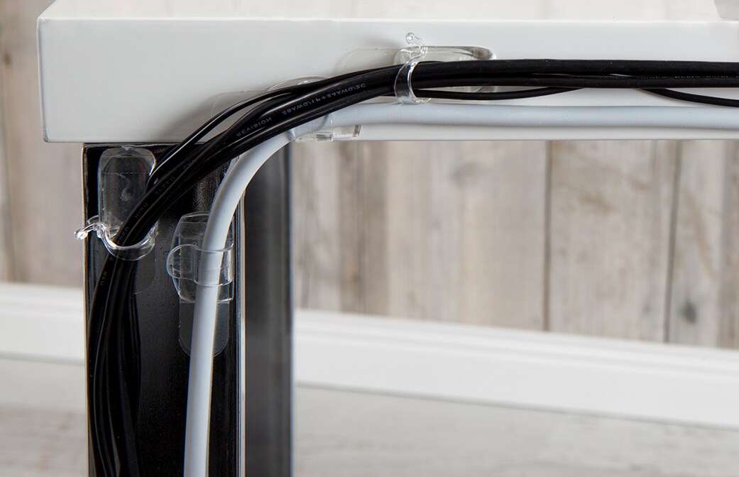 image of well-organized cords on the table with the help of command cord clips, organizers, and bundlers